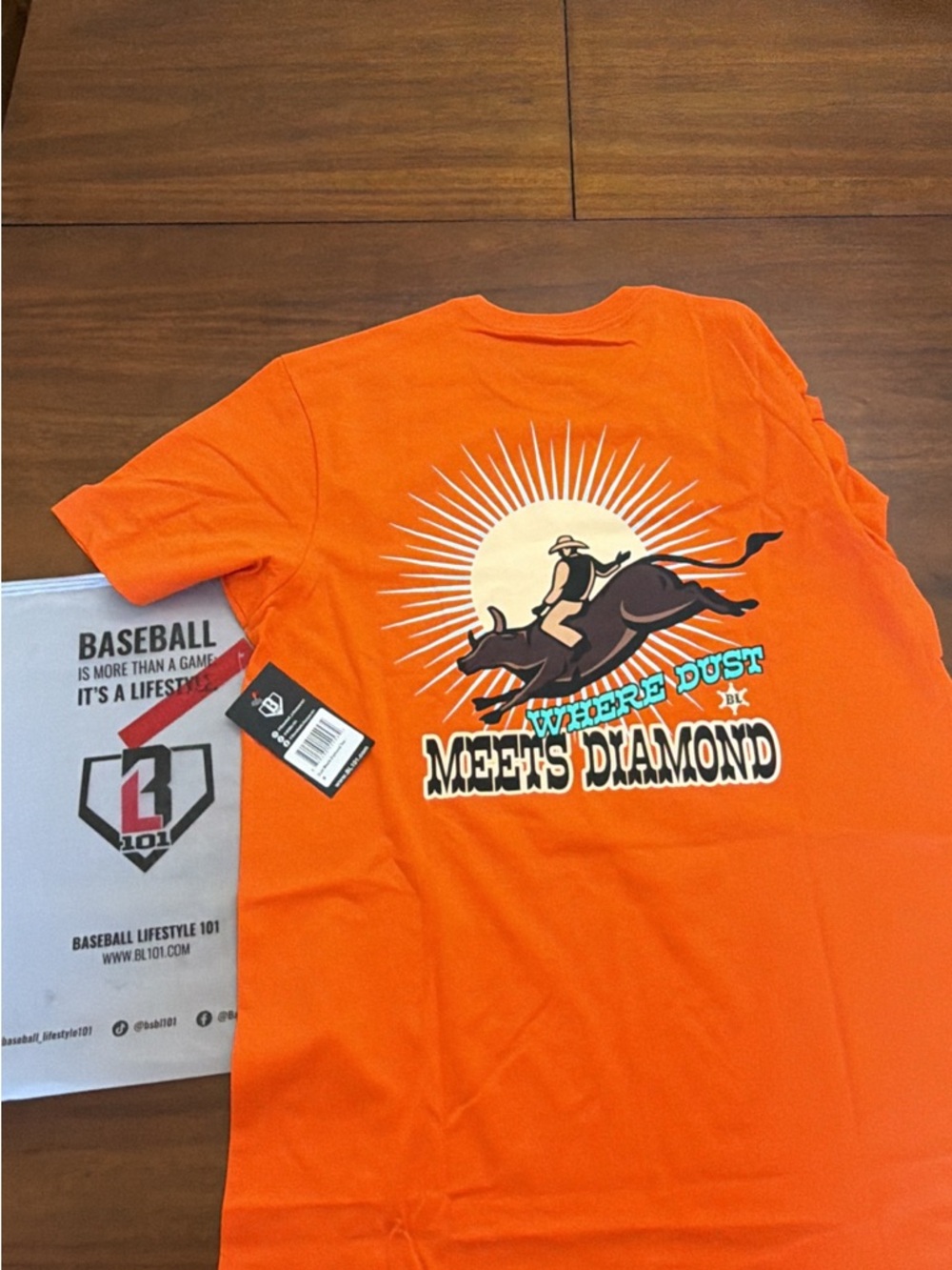 Where Dust Meets Diamond Orange Graphic Tee by BL